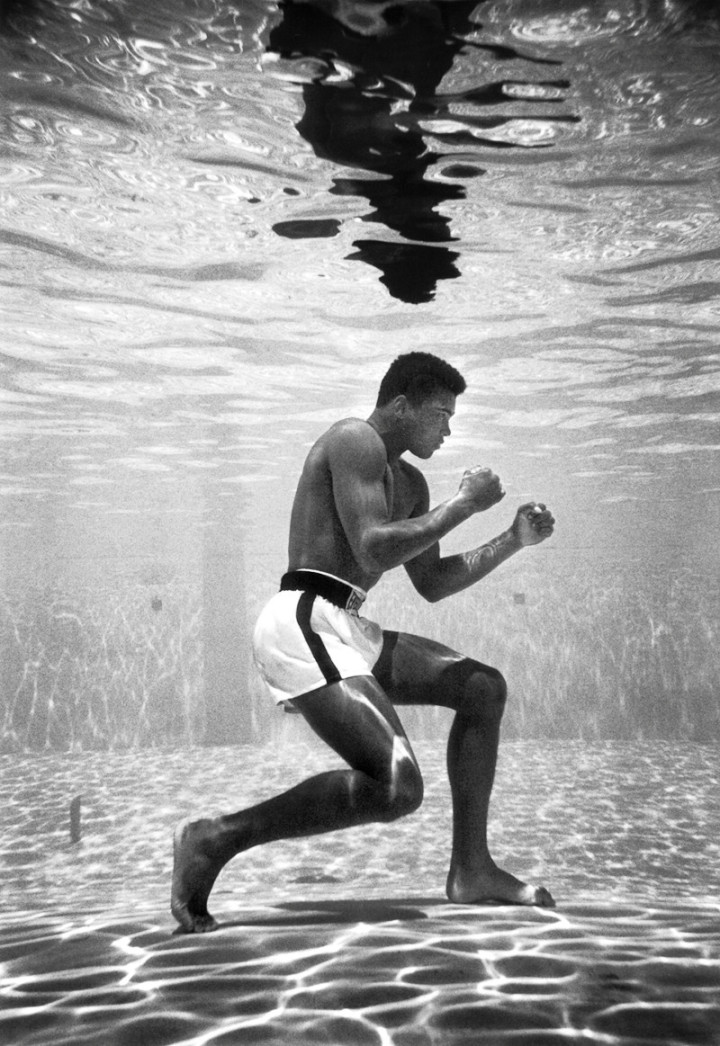 32. Muhammad Ali training in a pool at the Sir John Hotel in Miami, 1961 by Flip Schulke.