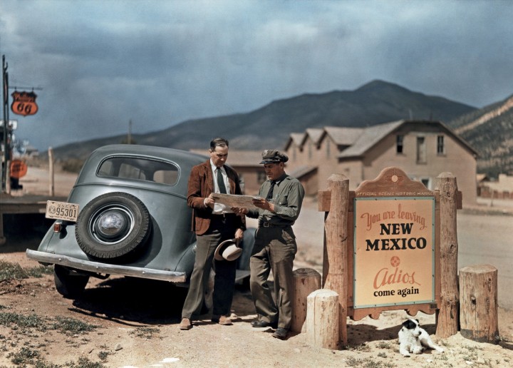 A motorist stops to get directions from a state trooper in New Mexico, 1939