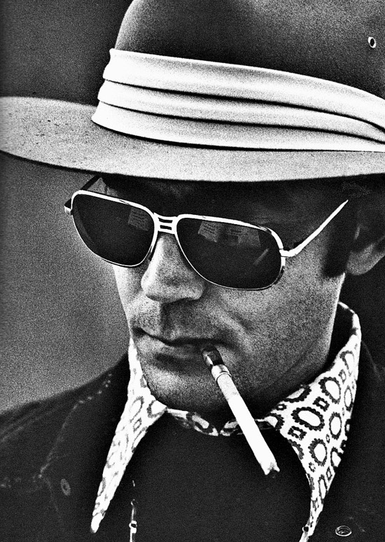 10c. Writer, Hunter S. Thompson, credited with creating Gonzo Journalism, enjoys his usual smoke