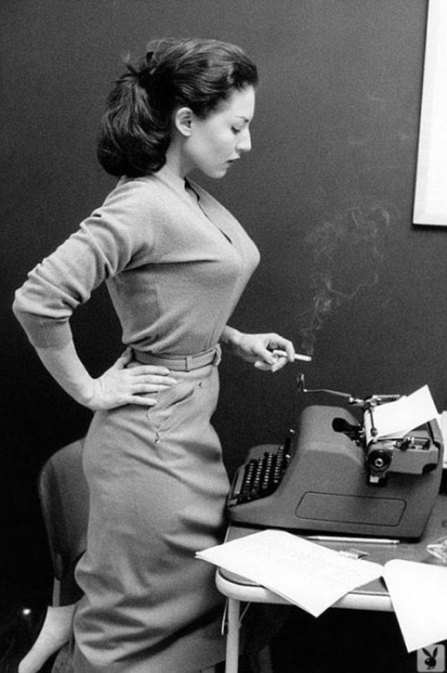 21. Girl with typewriter and a smoke