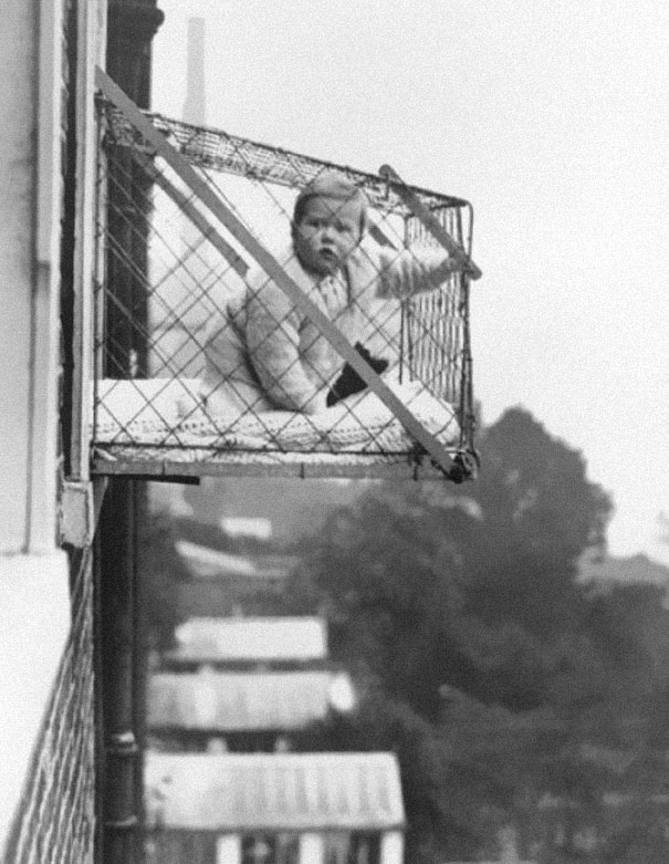 5. Baby cages used to ensure that children get enough sunlight and fresh air when living in an apartment building, ca. 1937