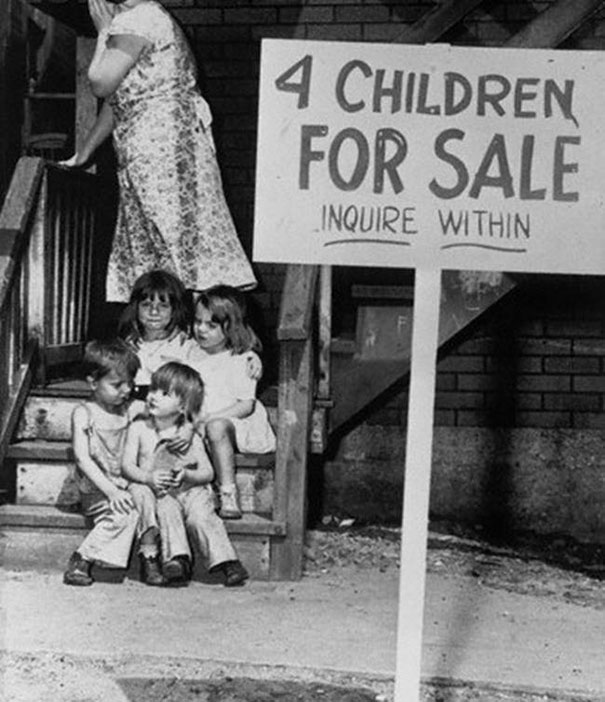 7. Mother hides her face in shame after putting her children up for sale, Chicago, 1948