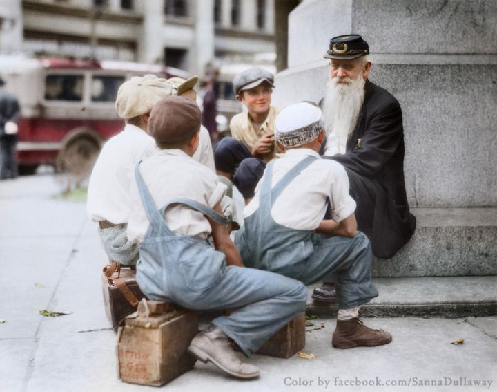26. A group of bootblacks gather around an old Civil War veteran for a wartime story in Pennsylvania, 1935