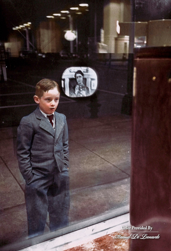 5. Boy watching TV for the first time in an appliance store window, 1948.