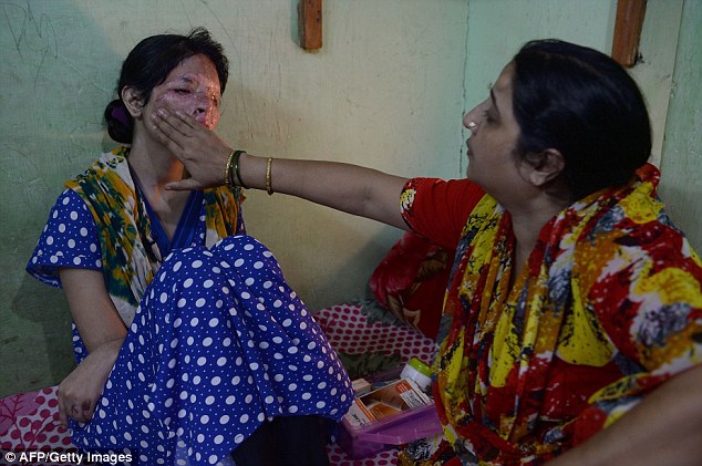 In pain Reshma's mother attempts to ease some of her discomfort by rubbing a cream