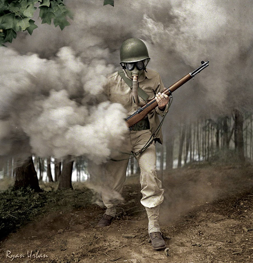 10. Sergeant George Camblair practicing with a gas mask in a smokescreen – Fort Belvoir, Virginia, 1942