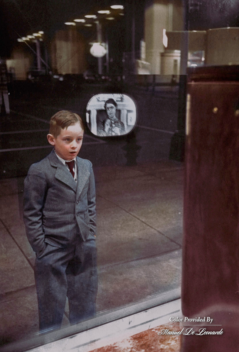 41. Boy watches TV  for the first time in an appliance store window, 1948