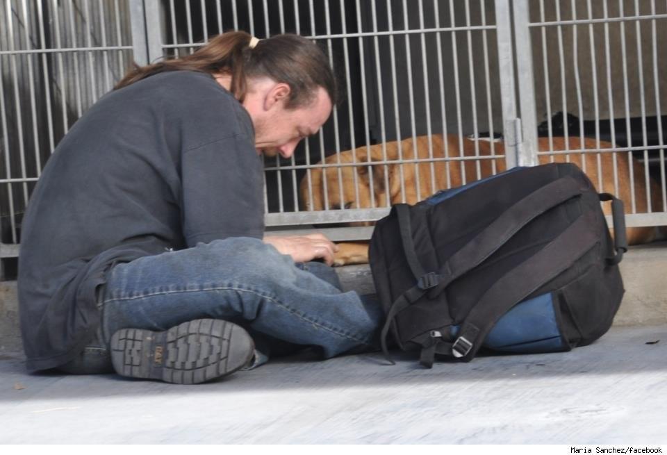 11. Man sobbing at animal shelter. After being jailed briefly and his dog Buzz Lightyear impounded he couldn't afford the $400 to get his pet back.