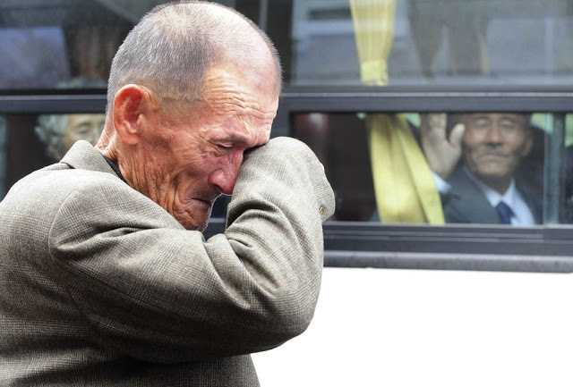 12. North Korean waves at his South Korean brother after inter-Korean temporary family reunions in 2010