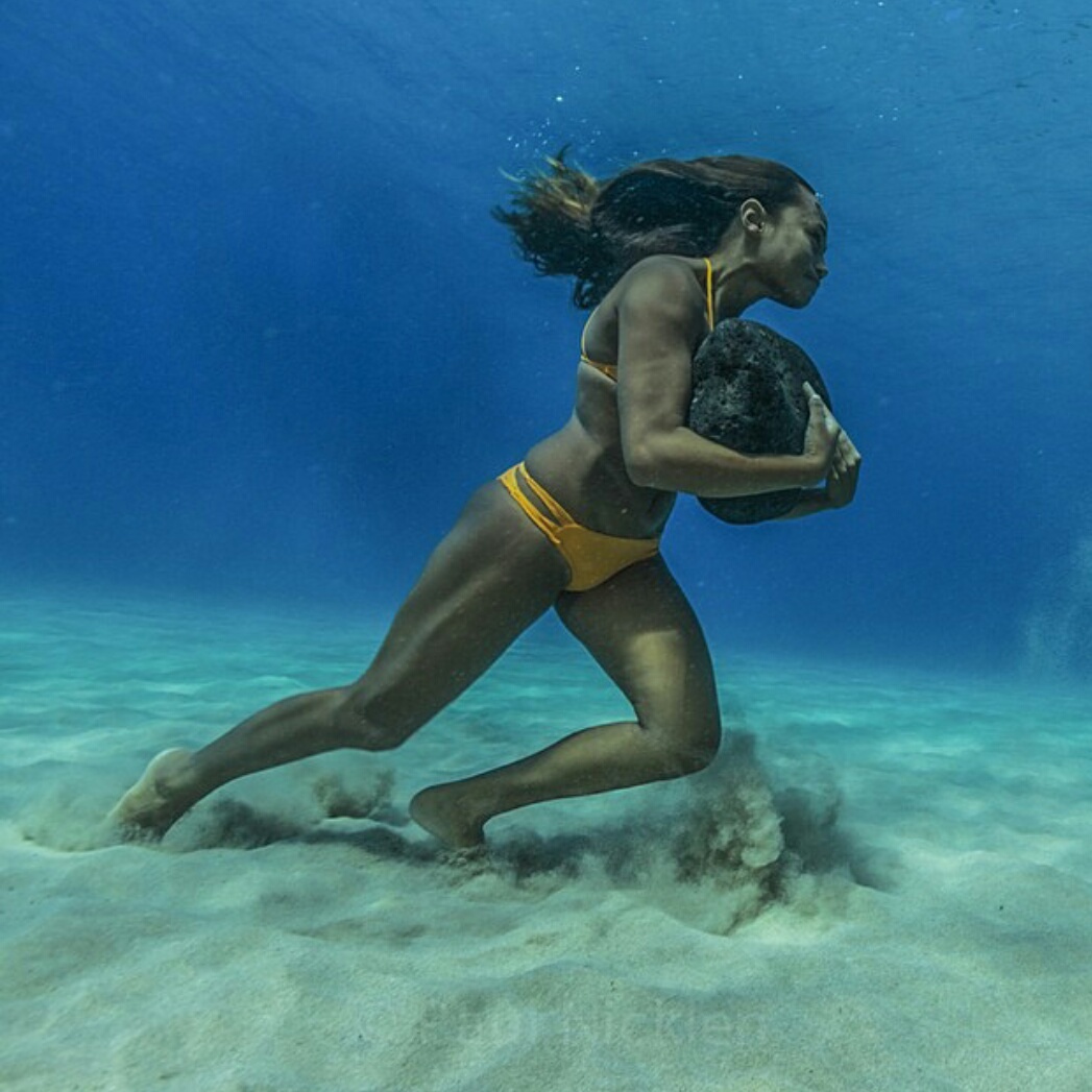 29. Hawaiian surfer Ha’a Keaulana runs across the ocean floor with a 50 pound boulder, as training to survive the massive surf waves