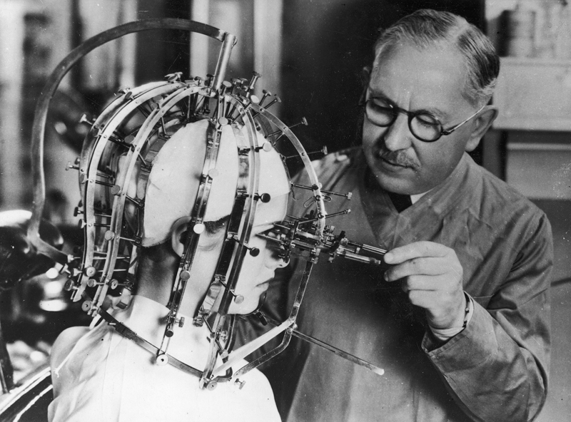 23. Max Factor using his beauty micrometer device on actress Dorothy Wilson