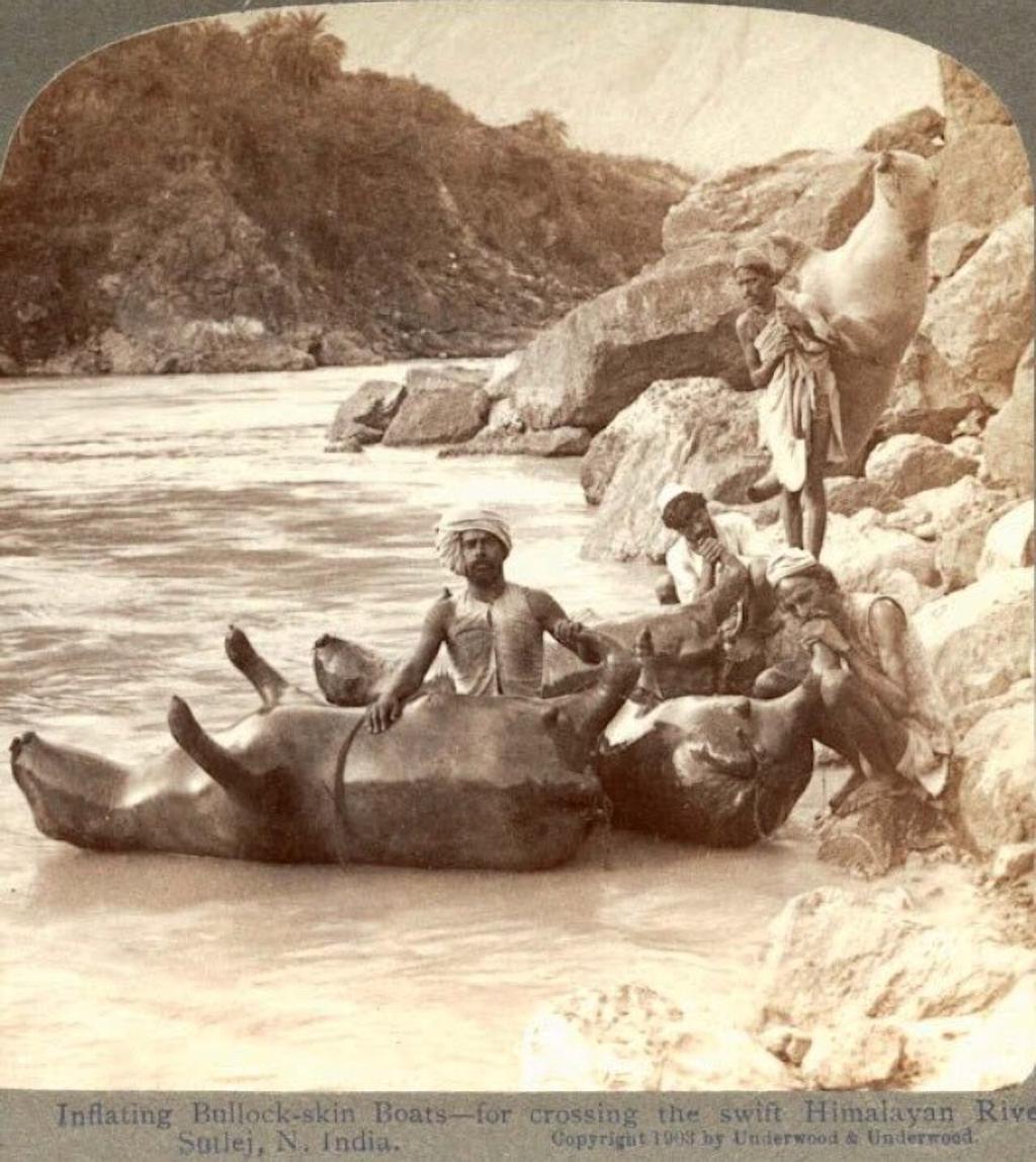 25. Inflating cow skins to use as boats in the Indian Himalayas (1903)