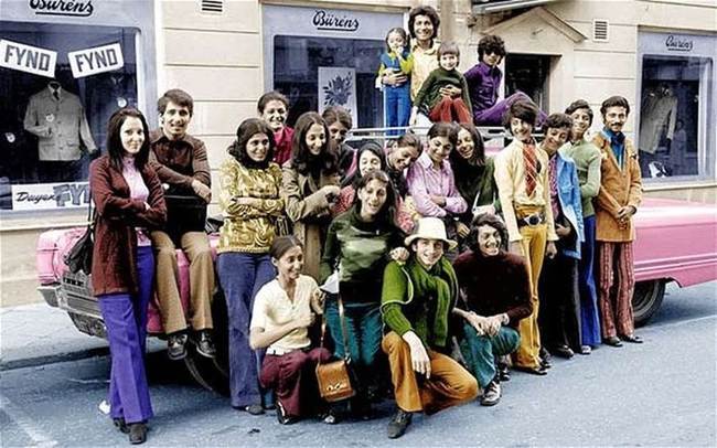 28. A young Osama Bin Laden with his family in Sweden during the 1970s. Bin Laden is second from the right in a green shirt and blue pants.